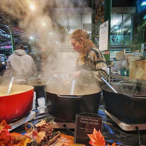 Steaming Soup at a Busy Market