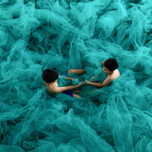 Children\\\'s games in fishing nets, Vietnam