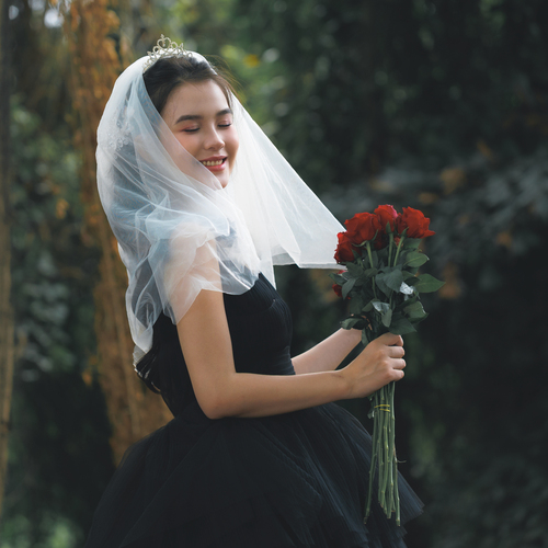 Veiled Elegance with Red Roses