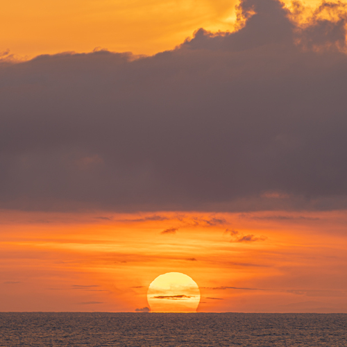Amber Glow Over the Caribbean Horizon