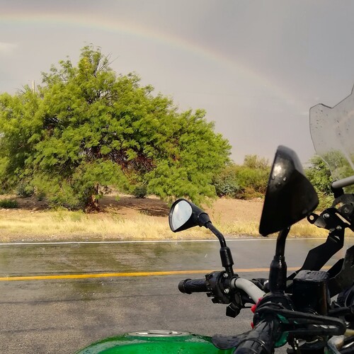 Rainbow, rain and motorbike