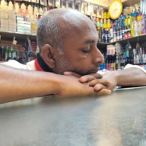 The Quiet Pause: A Shopkeeper\'s Rest