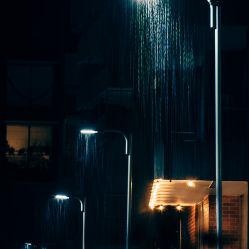 Luminous Downpour on a Nocturnal Street