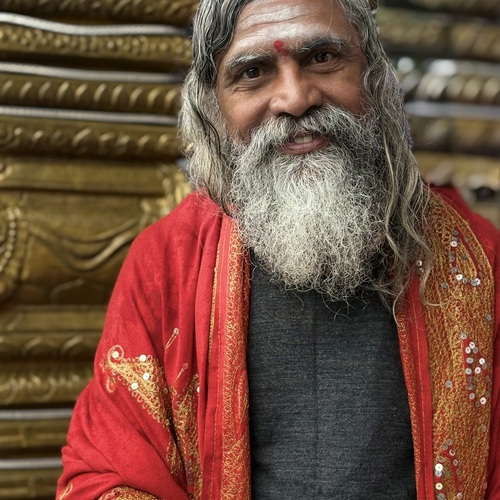 Elderly man celebrating in the rain during the Indra Jatra festival in  Nepal