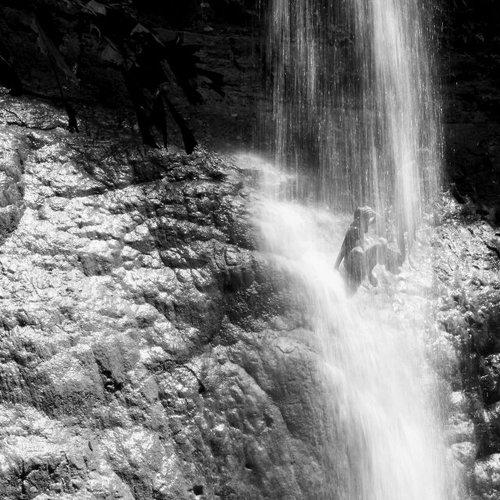 kids play at waterfall