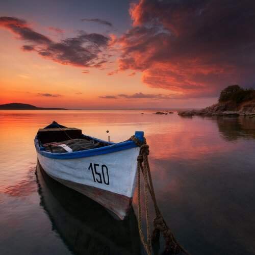 Lonely boat at sunset