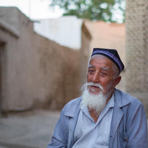 Uzbek man sitting on the street