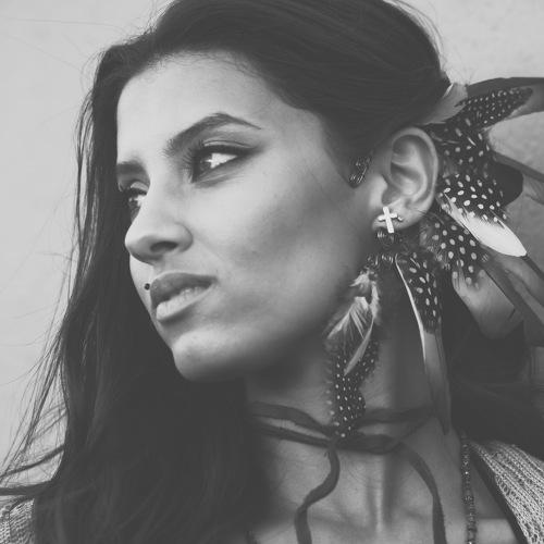 With feathers in her hair