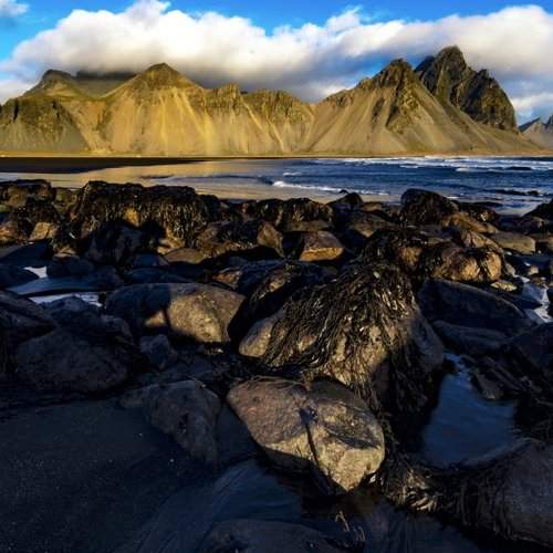 Orange Mountain and black sand beach