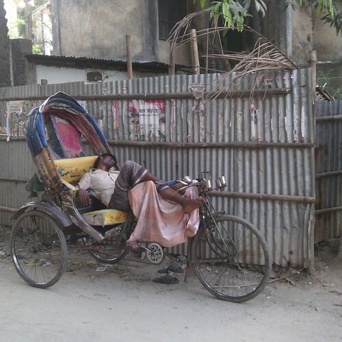 A tired Rickshaw puller