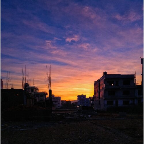 Sunrise behind building