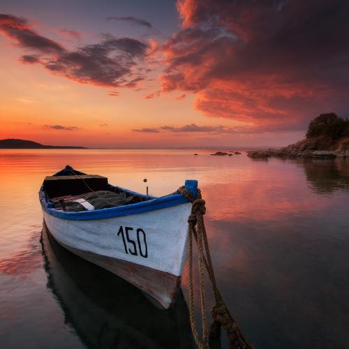 Lonely boat at sunset