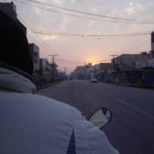 Dad driving while sun rising