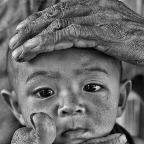 Young face and old finger