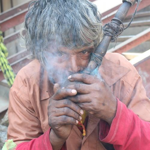 man smoking hukka