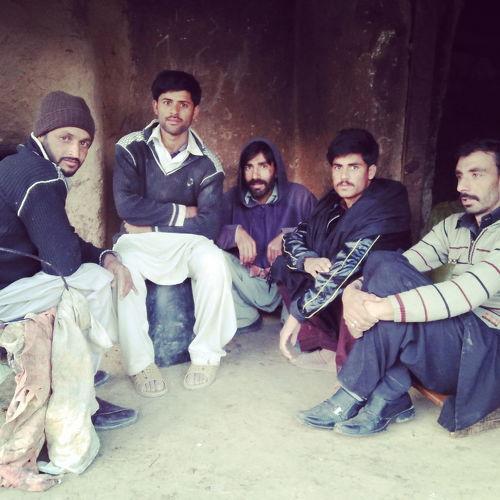 Some friends setting in village on shop