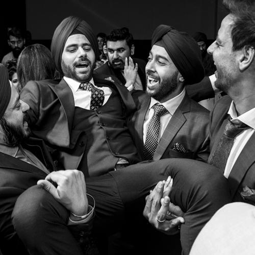 Friends are having fun with the groom.