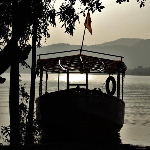 Boat on the shore of Koyana river at the time of sunset.