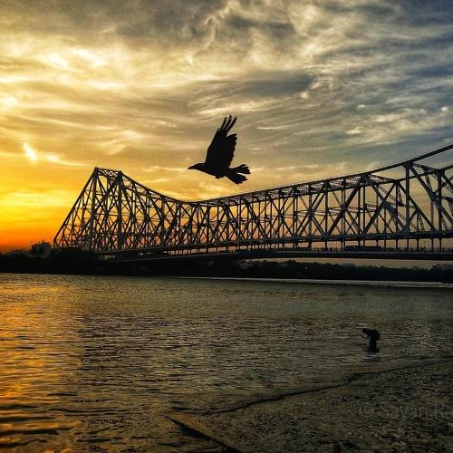 Sunset in Howrah Bridge .
