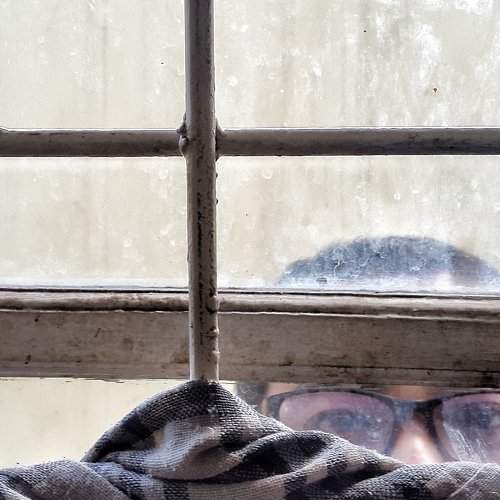Man behind window