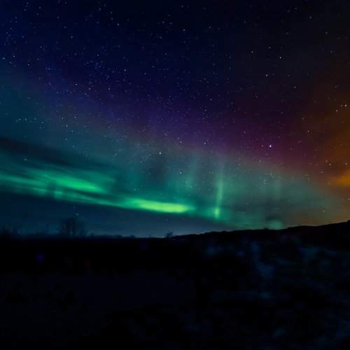 Nacreous Clouds and Aurora Borealis