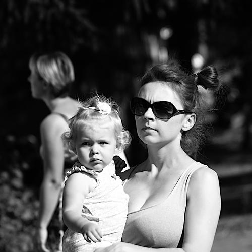 Portrait of mother and child walking in the park