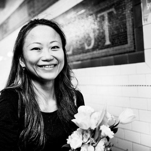 The girl with the bouquet of flowers.
