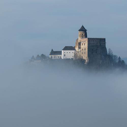 castle Lubovna flying in clouds