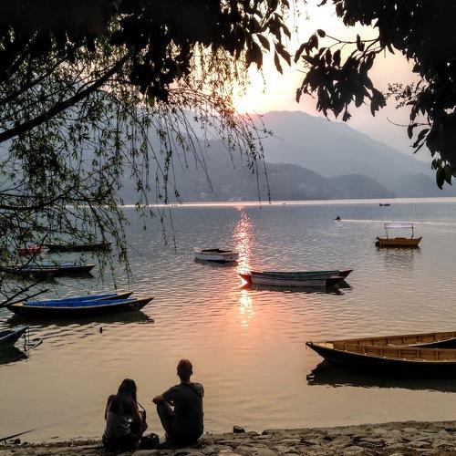 Lovers on the lake at sunset