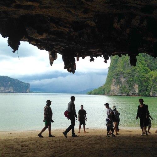 Silhouettes of people in the cave