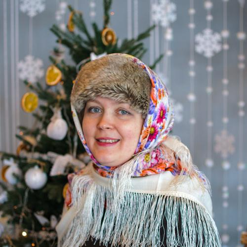 Smiling woman in hat and shawl