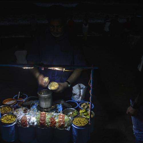 The seaside jhalmuri Seller at night