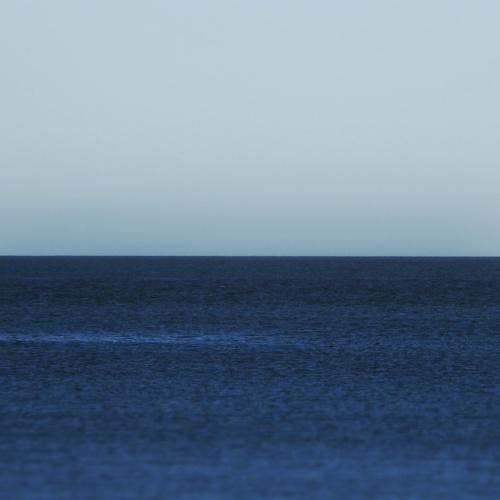 Boats in the sea horizon