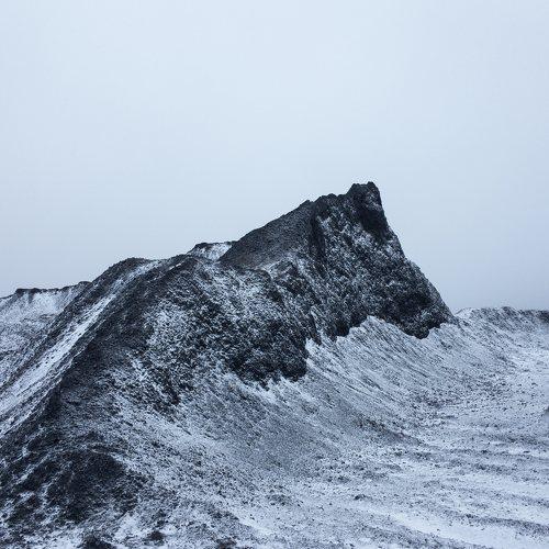 Black rock under the snow