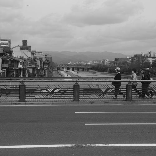 People walk on the bridge