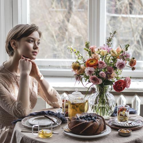 Dreamy girl at breakfast
