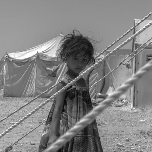The girl with the fish in the refugee camp