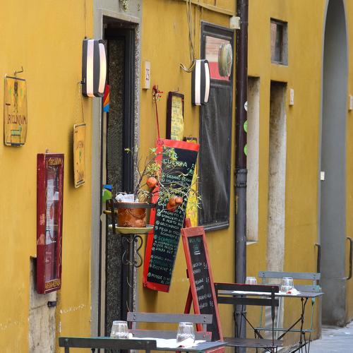 Empty cafe by a street in Pisa, Italy