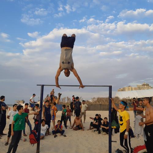 Young people in the Gaza Strip practice gymnastics on the beach, as they are the only outlet in light of the siege imposed by the Israeli occupation.