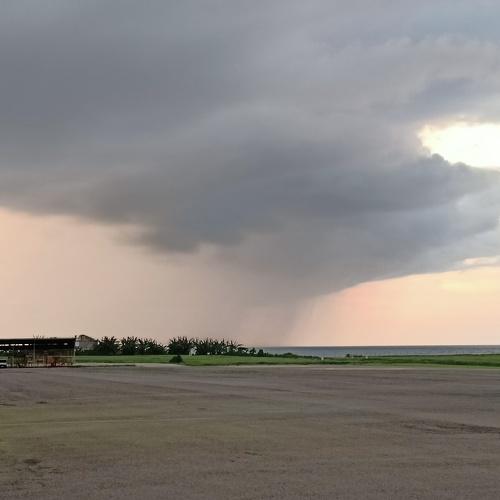 Beautiful sunset at the Dili airport with the approaching weather