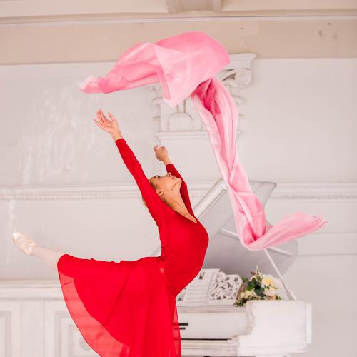 Ballerina dancing with fabric