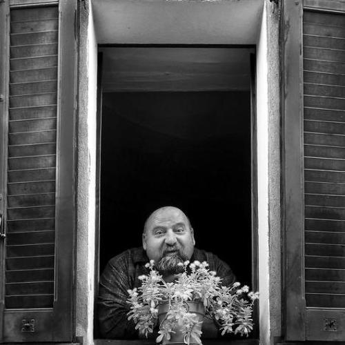 Man and flowers at the window