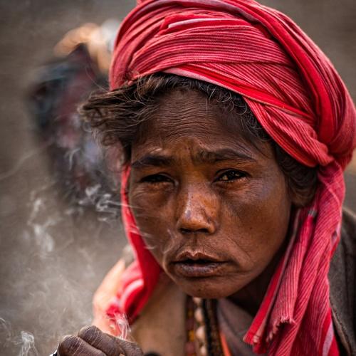 Lady sadhu taking a drag