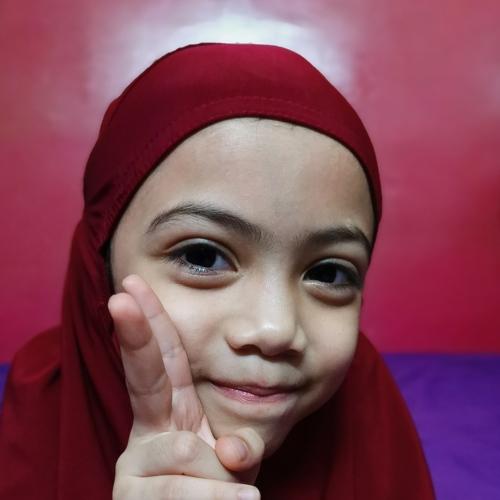 Child in Telekung after Solat