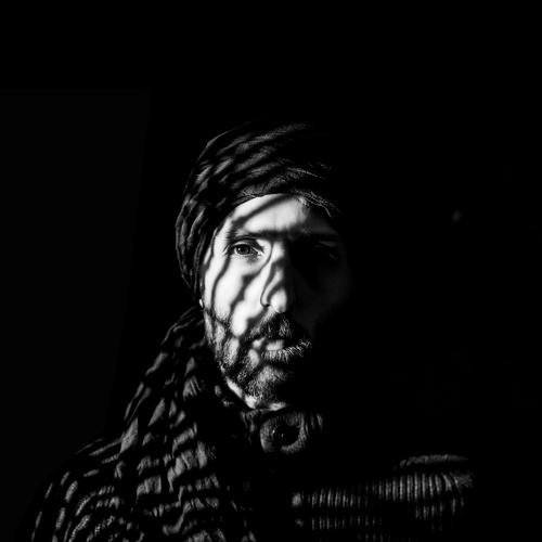 A man enclosed in shadows