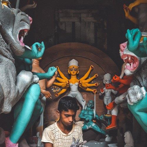 Sculptor who makes God.