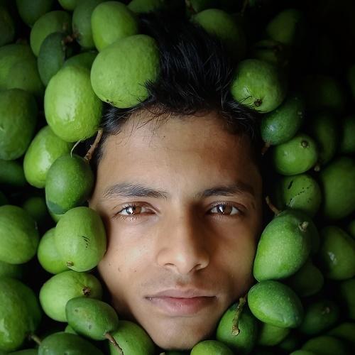 Man Burried Under Raw Mango