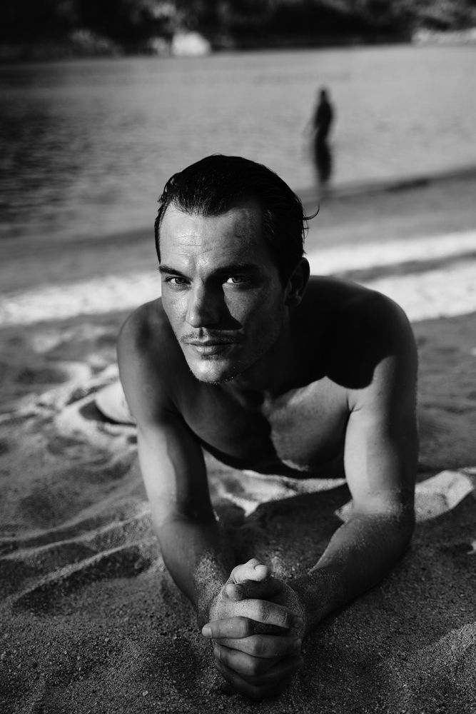 Portrait of male model by lake